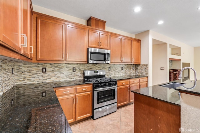 3642 Mallard Way, Antioch, CA 94509 - kitchen featuring dark stone countertops, light tile patterned floors, a sink, tasteful backsplash, and appliances with stainless steel finishes