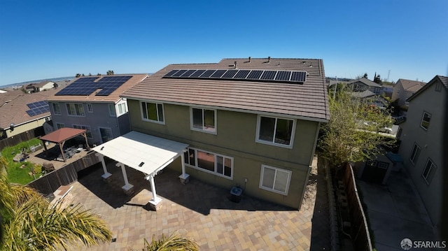 3642 Mallard Way, Antioch, CA 94509 - rear view of property featuring a gazebo, a patio area, a fenced backyard, roof mounted solar panels, and a residential view