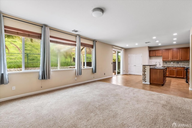 3642 Mallard Way, Antioch, CA 94509 - unfurnished living room featuring baseboards, a sink, recessed lighting, and light colored carpet