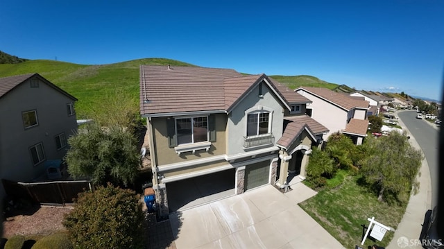 3642 Mallard Way, Antioch, CA 94509 - traditional home featuring concrete driveway, a tile roof, a mountain view, and an attached garage