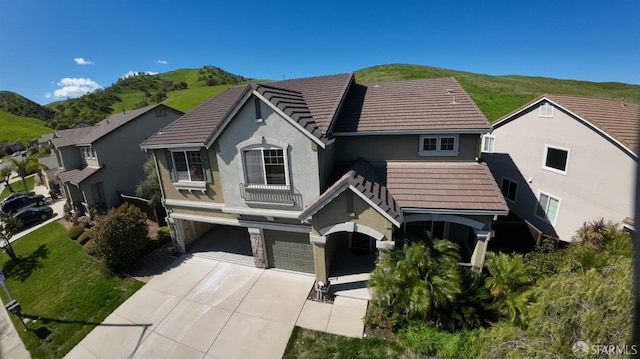 3642 Mallard Way, Antioch, CA 94509 - view of front of home with stucco siding, an attached garage, a mountain view, and concrete driveway