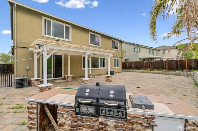 3642 Mallard Way, Antioch, CA 94509 - back of house featuring an outdoor kitchen, a pergola, a fenced backyard, stucco siding, and a patio