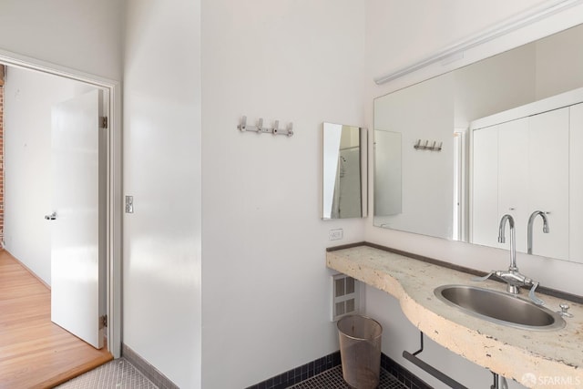 bathroom with tile patterned floors and sink