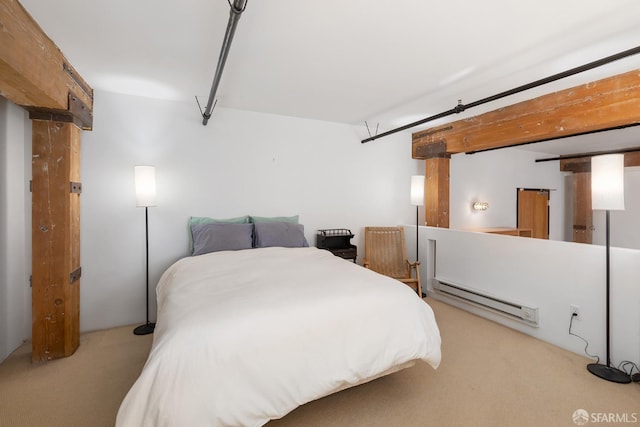 bedroom featuring light colored carpet and a baseboard heating unit