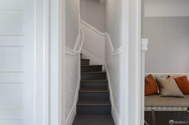 staircase with wood-type flooring