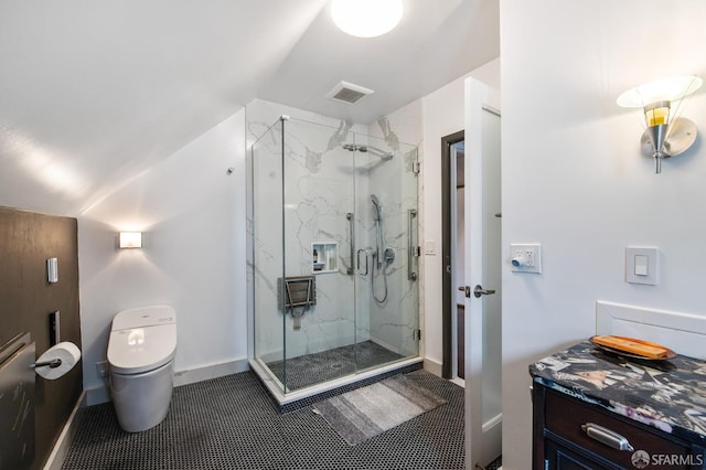 bathroom with a shower with shower door, vaulted ceiling, and toilet