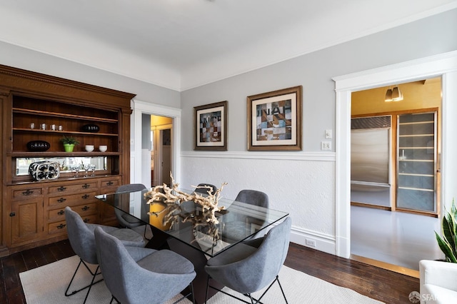 dining room with dark hardwood / wood-style floors