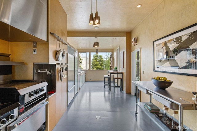 kitchen featuring hanging light fixtures and stainless steel range oven