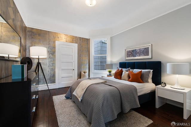 bedroom with dark wood-type flooring