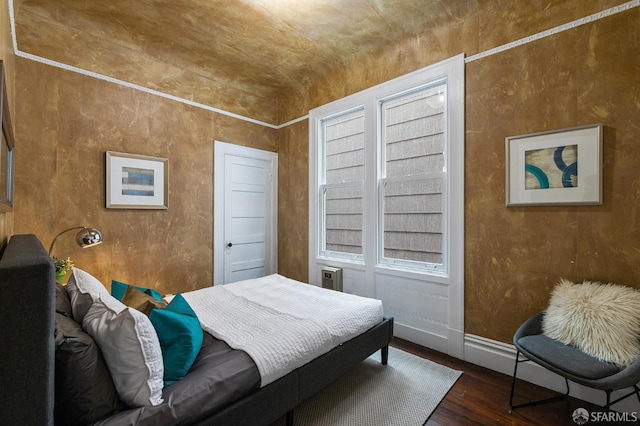 bedroom featuring dark wood-type flooring