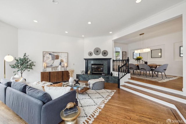 302 Warren Dr, San Francisco, CA 94131 - living area with wood finished floors, recessed lighting, a high end fireplace, and a chandelier
