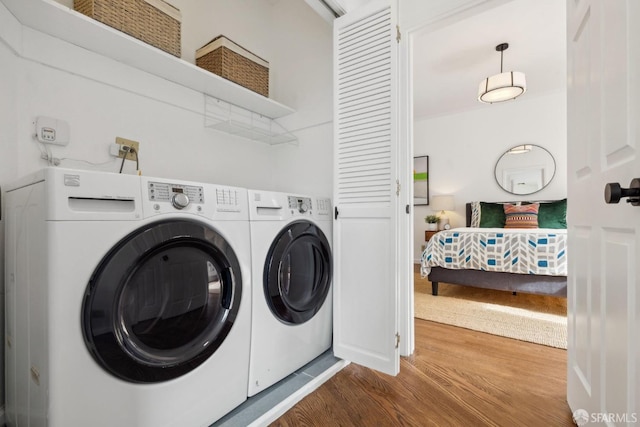 302 Warren Dr, San Francisco, CA 94131 - laundry room with washer and dryer and wood finished floors