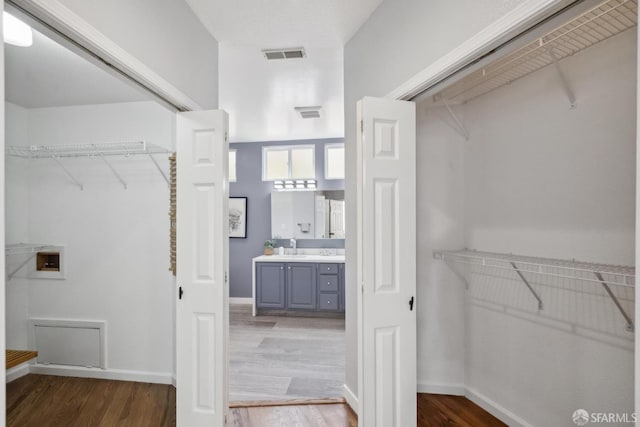 302 Warren Dr, San Francisco, CA 94131 - walk in closet featuring wood finished floors