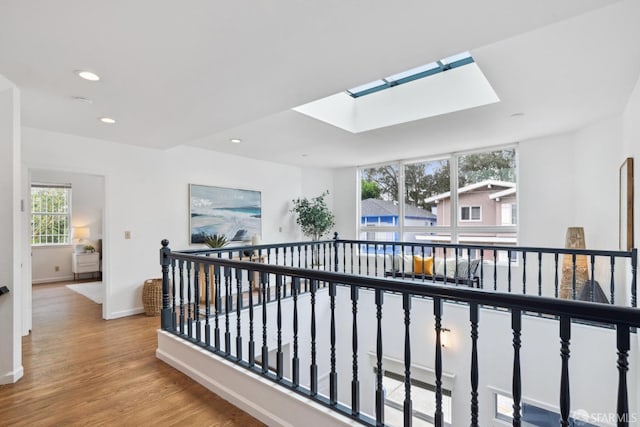 302 Warren Dr, San Francisco, CA 94131 - hall with a skylight, an upstairs landing, wood finished floors, and recessed lighting
