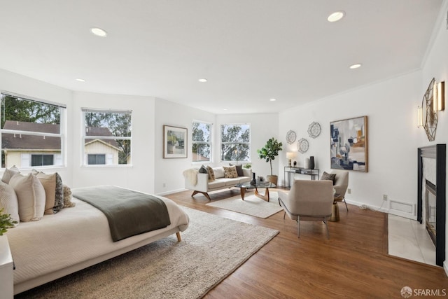 302 Warren Dr, San Francisco, CA 94131 - bedroom featuring recessed lighting, wood finished floors, and a fireplace with flush hearth