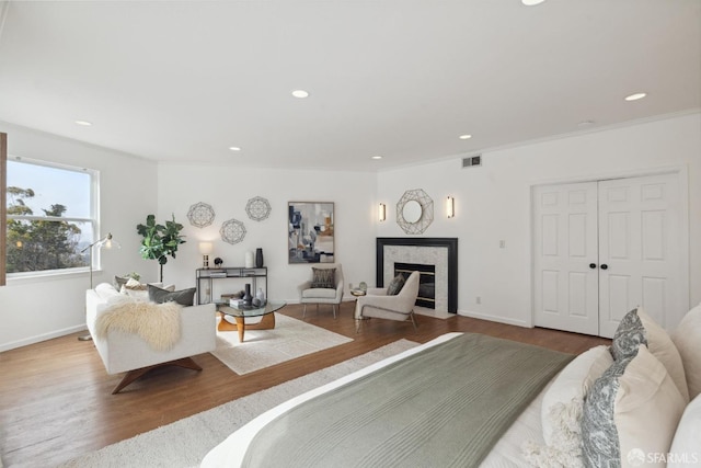 302 Warren Dr, San Francisco, CA 94131 - bedroom with wood finished floors, recessed lighting, a high end fireplace, and a closet