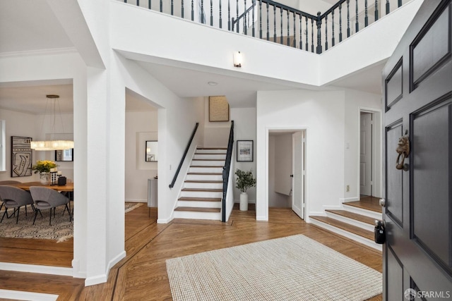 302 Warren Dr, San Francisco, CA 94131 - foyer entrance with stairs, wood finished floors, a high ceiling, and a chandelier