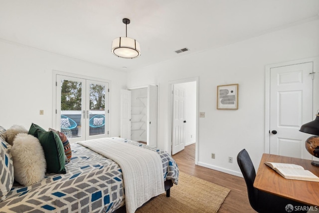 302 Warren Dr, San Francisco, CA 94131 - bedroom with wood finished floors, access to exterior, french doors, and a desk