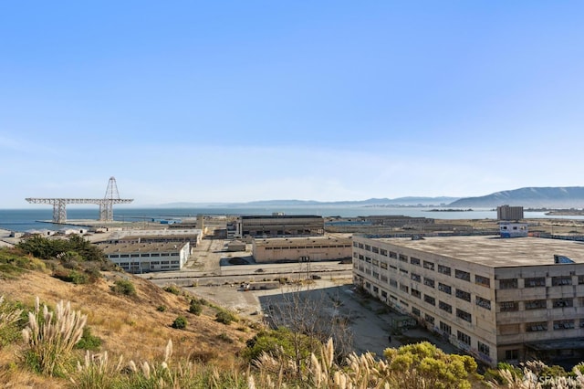 exterior space with a water and mountain view