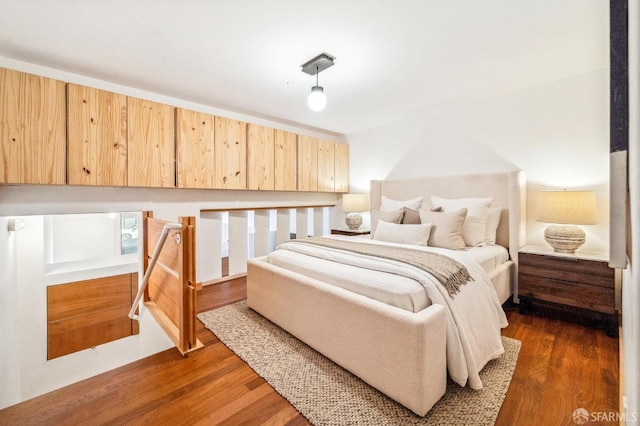 bedroom featuring dark hardwood / wood-style flooring