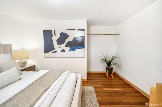 bedroom with wood-type flooring