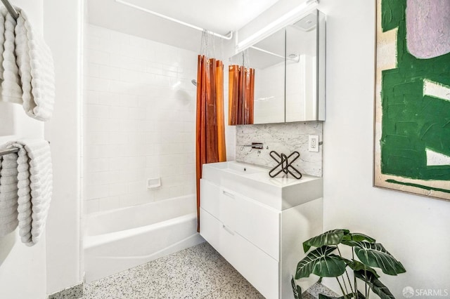 bathroom featuring vanity, decorative backsplash, and shower / bath combination with curtain