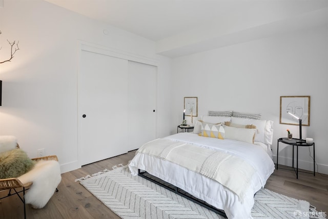 bedroom with a closet and light wood-type flooring