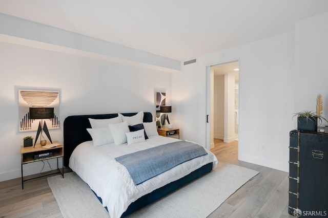 bedroom with wood-type flooring