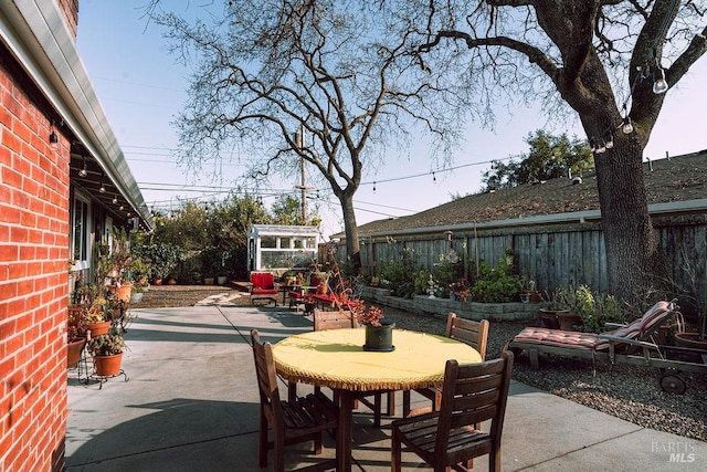 view of patio / terrace featuring outdoor dining space and a fenced backyard