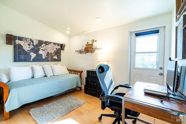 bedroom with recessed lighting, light wood-style floors, and lofted ceiling