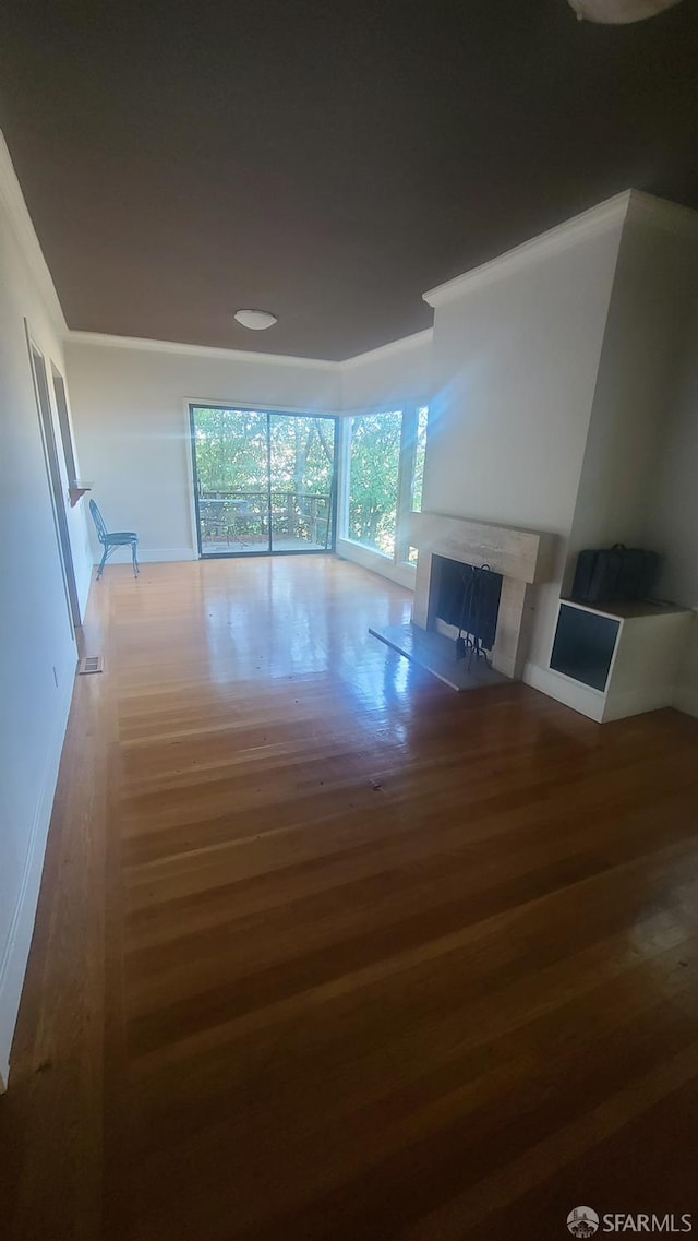 unfurnished living room with hardwood / wood-style flooring