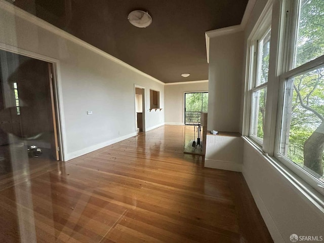 30 Harry St, San Francisco, CA 94131 - empty room featuring crown molding, wood finished floors, and healthy amount of natural light