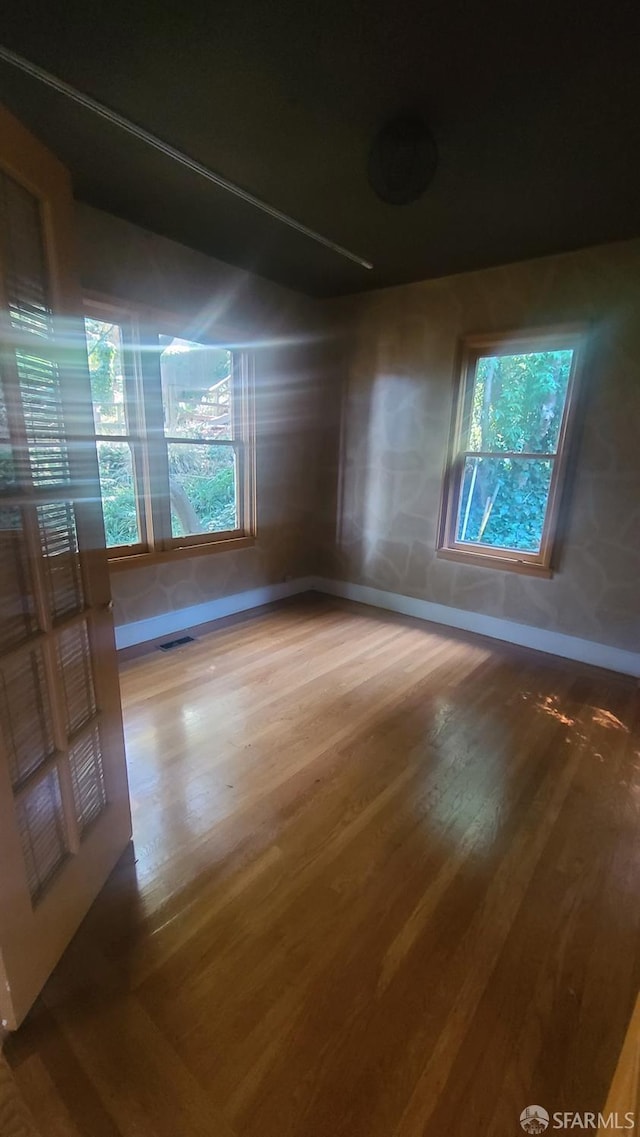 spare room featuring hardwood / wood-style flooring