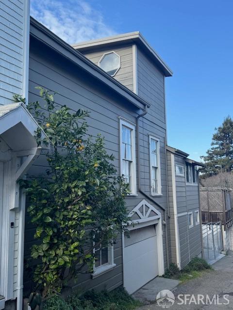 view of property exterior with a garage