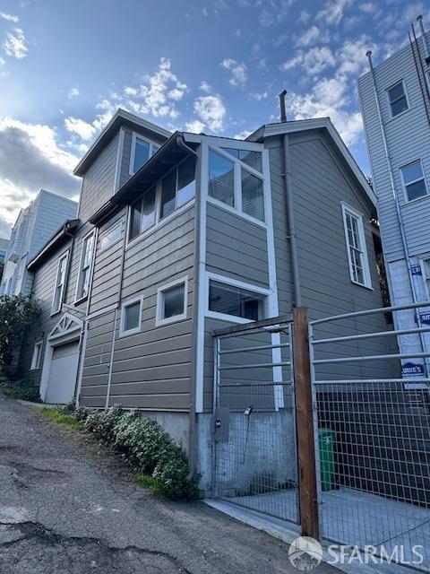 view of side of home with a garage