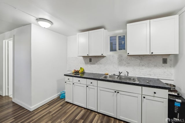 1527 Palou Ave, San Francisco, CA 94124 - kitchen with a sink, dark wood finished floors, tasteful backsplash, white cabinets, and baseboards