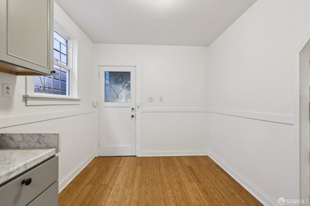 1527 Palou Ave, San Francisco, CA 94124 - entryway with light wood-style flooring and baseboards