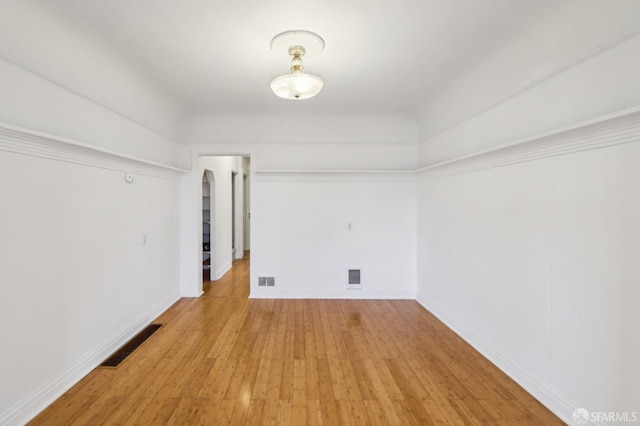 1527 Palou Ave, San Francisco, CA 94124 - empty room featuring light wood-style flooring, arched walkways, and baseboards