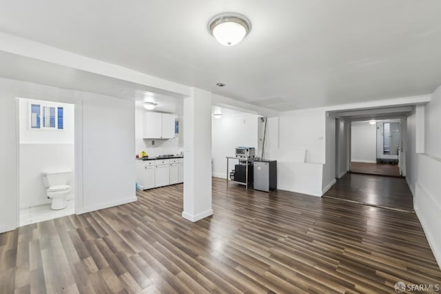 1527 Palou Ave, San Francisco, CA 94124 - unfurnished living room featuring dark wood-style floors and baseboards