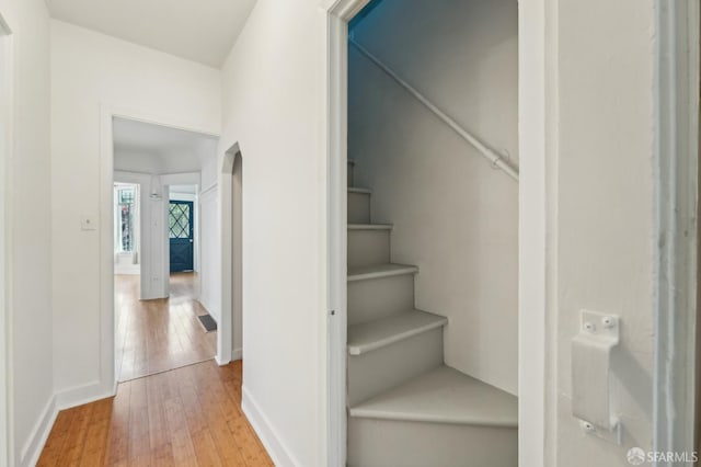 1527 Palou Ave, San Francisco, CA 94124 - stairs featuring hardwood / wood-style floors and baseboards