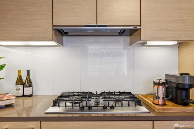 301 Mission St Unit 6J, San Francisco, CA 94105 - kitchen view of stainless steel gas cooktop and range hood