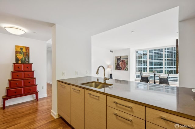 301 Mission St Unit 6J, San Francisco, CA 94105 - kitchen with light wood-type flooring and light brown cabinets