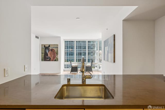 301 Mission St Unit 6J, San Francisco, CA 94105 - kitchen with a sink and a wall of windows