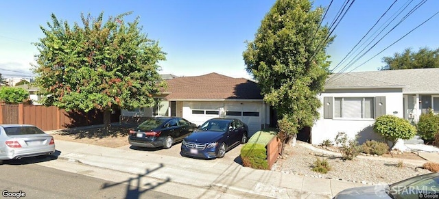60-64 W 39th Ave, San Mateo, CA 94403 - view of front of property featuring an attached garage, driveway, and stucco siding