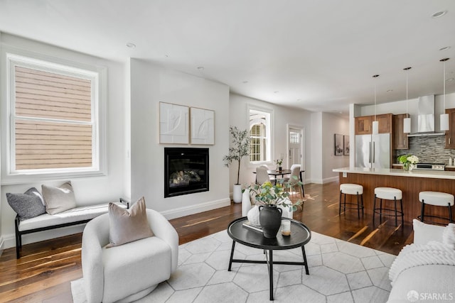 2486 Fulton St, San Francisco, CA 94118 - living area featuring a glass covered fireplace, wood finished floors, baseboards, and recessed lighting