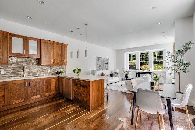 2486 Fulton St, San Francisco, CA 94118 - kitchen featuring a sink, brown cabinets, a peninsula, dark wood-style floors, and light countertops