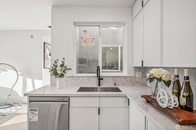 31 Romolo Pl Unit 6, San Francisco, CA 94133 - kitchen featuring a sink, light stone counters, stainless steel dishwasher, and white cabinets