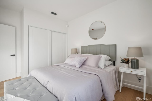 31 Romolo Pl Unit 6, San Francisco, CA 94133 - bedroom featuring wood finished floors, a closet, and baseboards