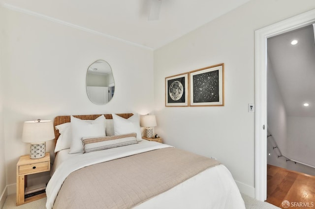 bedroom with hardwood / wood-style flooring and ceiling fan