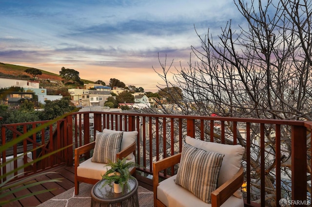 view of balcony at dusk